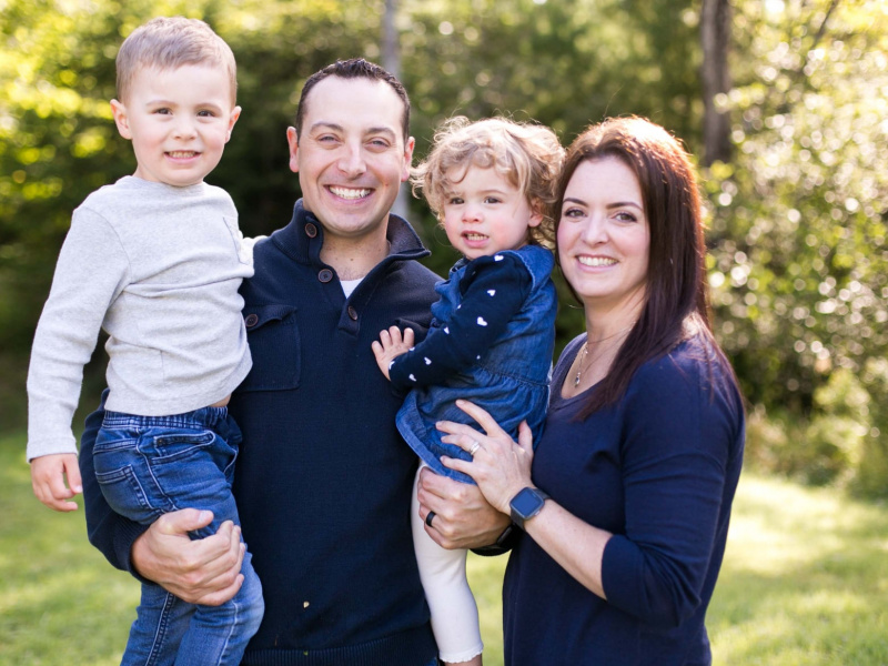 Kate Brown and her beautiful family are smiling for the camera.