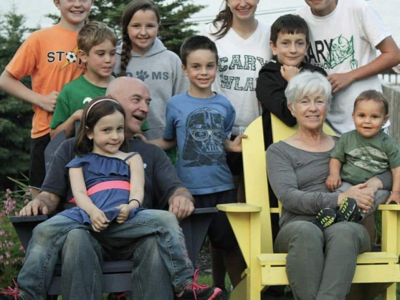 Pattrick Dunphy, a Hubbards resident, lovingly smiles at wife while surrounded by their nine grand children.