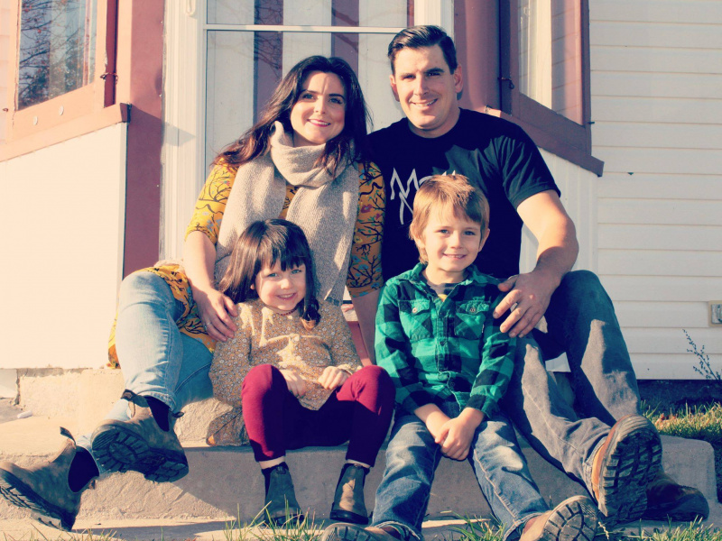 Sarah Hare, Hubbards Streetscape committee member, smiling with husband, daughter and son on front doorstep of their residence.