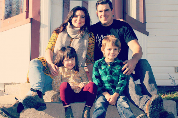 Sarah Hare, Hubbards Streetscape committee member, smiling with husband, daughter and son on front doorstep of their residence.